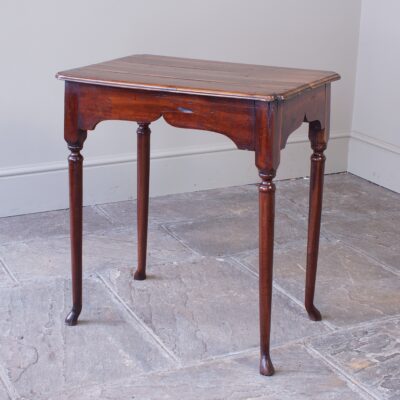 A small, early 18th-century fruitwood centre table.