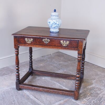 A late 17th-century oak side table