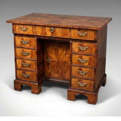 A William and Mary Kingwood oyster-veneered kneehole secretaire desk.