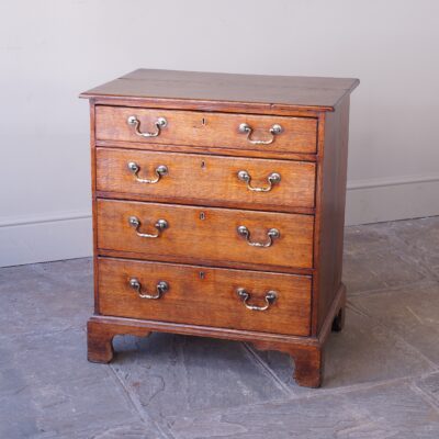 A Very Small Georgian Oak Chest of Drawers.
